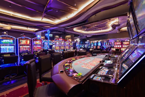 A glowing roulette wheel with cascading chips, symbolizing the engaging live and instant-win games available on 5666BED.
